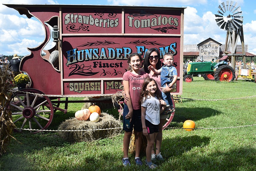Going to the Pumpkin Festival is a tradition for Myakka City 12-year-old Collette Armstrong, 8-year-old Jeanette Armstrong, Cristina Rosas and 21-month-old Lincoln Armstrong.