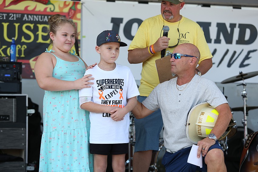 Abby and Adyn Pickett are cheered on by the crowd,