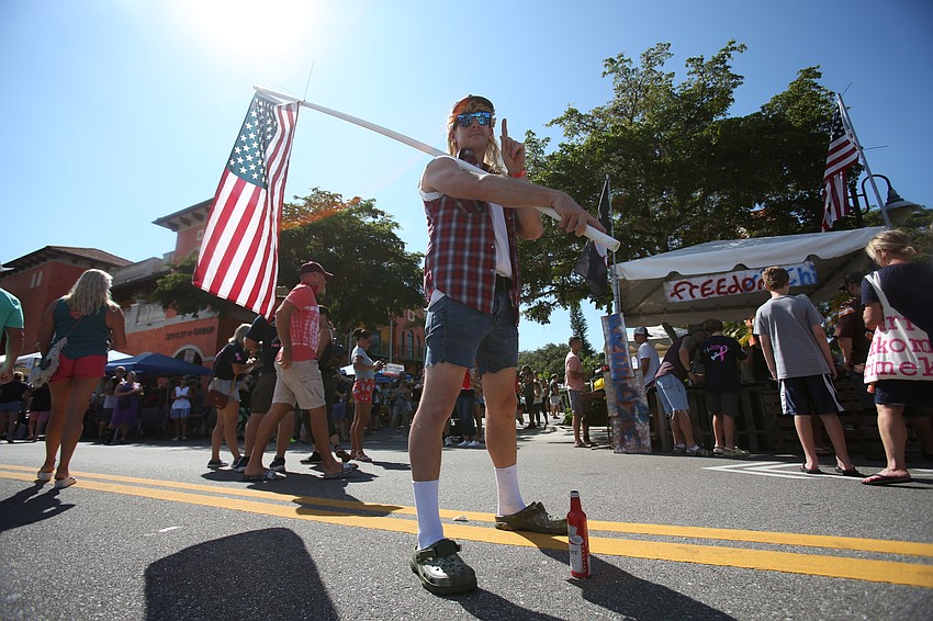 Kyle Kosianowski proudly waves the flag.
