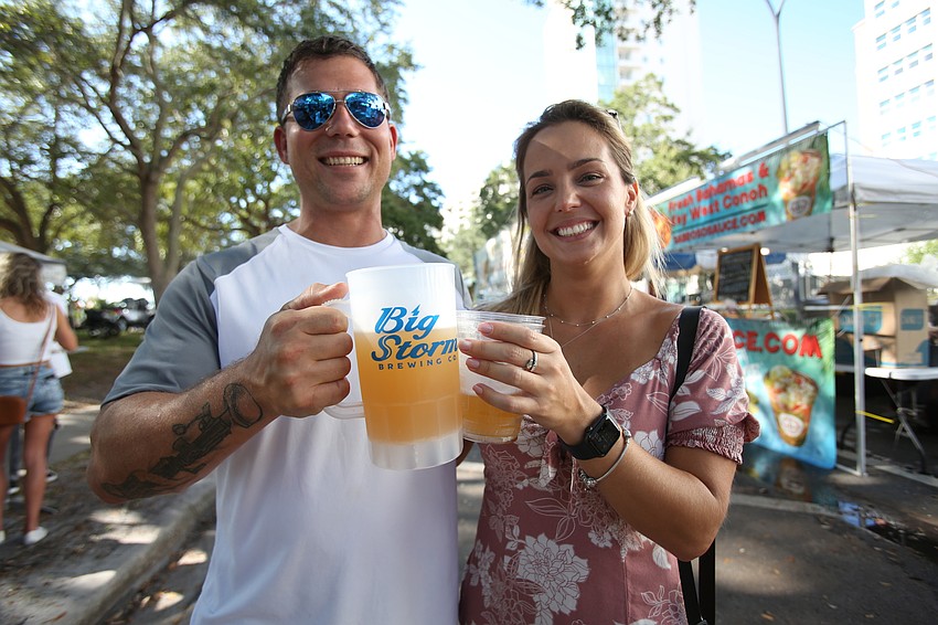 Brian Burress and Liv Coutinho pick up some beers.