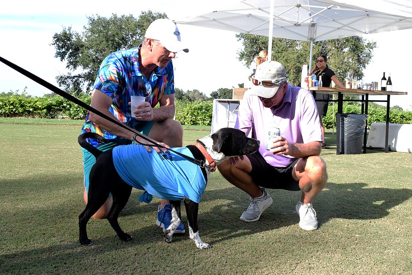 Lakewood Ranch's Rick Reid and Jeff Boudrie meet Rosé, a dog that is up for adoption at the Humane Society at Lakewood Ranch.