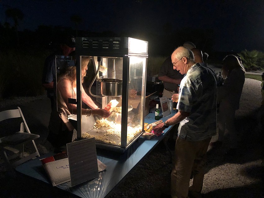 Attendees grabbed popcorn during the movie after the sun went down. Courtesy photo.