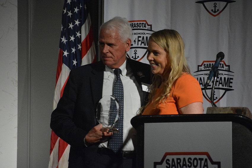 Dan Bailey is presented with the Community Service Award by Jeana Schmidt.