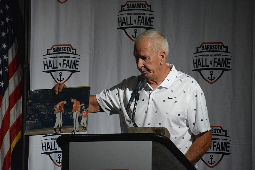 Dave Million shares a photo of his son, Doug Million, and Sarasota baseball Coach Clyde Metcalf during a mound visit. Doug Million, a pitcher in the Colorado Rockies organization, died of an asthma attack in 1997 at 21 years old.