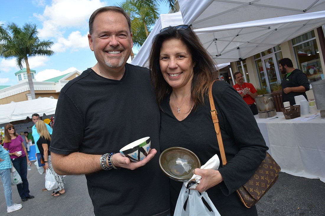 Lakewood Ranch&#39;s John and Diane Justice enjoy eating soup during Empty Bowls, which will return as an in-person event on Main Street at Lakewood Ranch this year. File photo.