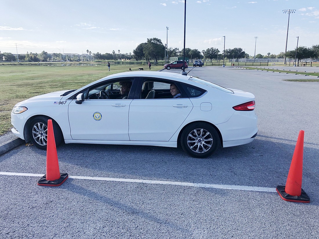 Lakewood Ranch High School&#39;s Kevin Everhart and Andrew Legutko practice parking during drivers education. Courtesy photo.
