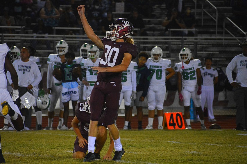 Pirates kicker Colin Boyd raises his fist after hitting a 40-yard field goal.