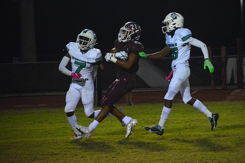 Pirates senior Nehemiah Jenkins (21) pulls up after reaching the end zone on a 13-yard run. The score made it 10-0 Braden River, but the Pirates would lose 14-10.