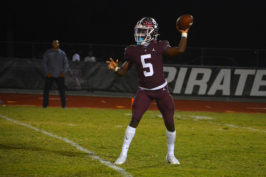 Pirates senior Bryan Kearse throws a pass to his left. Kearse completed four of five passes for 56 yards.