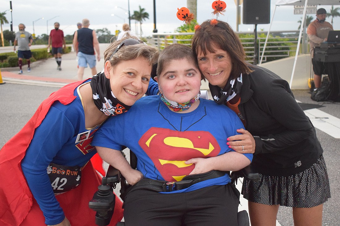 Lakewood Ranch&#39;s Monika Oberer, Grayson Tullio and Jennifer Tullio get ready to kick off the annual Boo Run at Nathan Benderson Park Oct. 31, 2020. The race will return to Nathan Benderson Park this year. File photo.