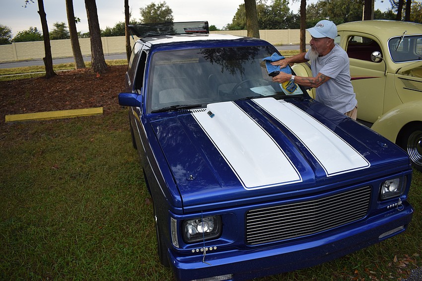 North Port's Tommy West puts the finishing touches on his 1991 Chevy S-10 Blazer before the show.