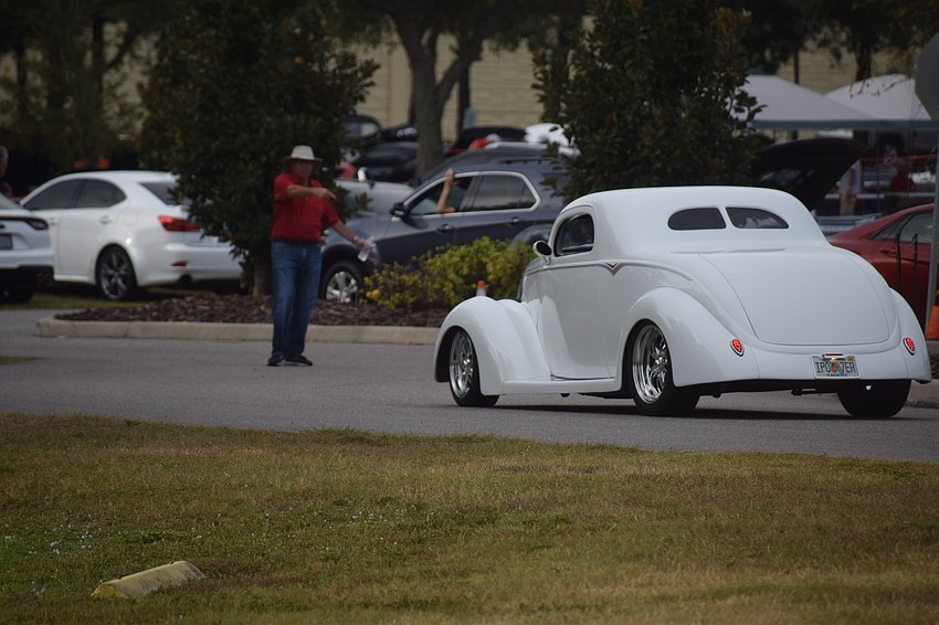 Vintage cars continued to roll into the event just moments before it opened to the public.