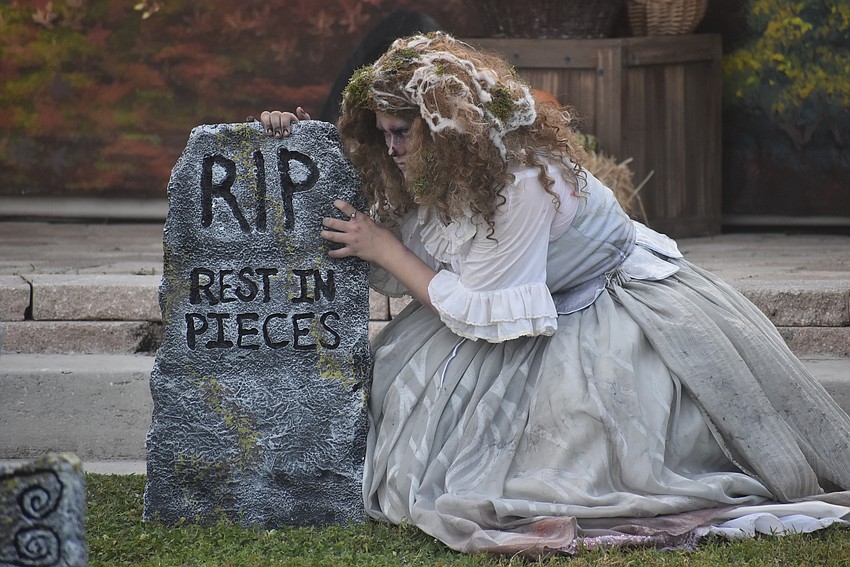 The Woman in White (Abigail Clark) gets ready to come out of the 