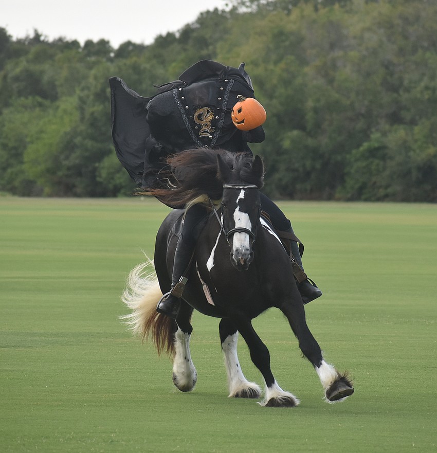 The Headless Horseman makes its entrance to the delight of the crowd at Saturday's fifth annual performance of The Legend of Sleepy Hollow at the Sarasota Polo Club in Lakewood Ranch.