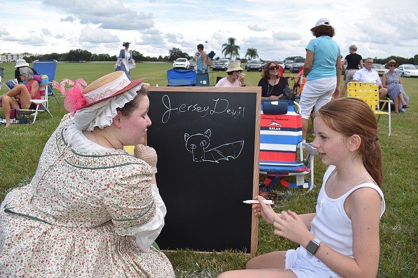 Jane Callahan (right) gets an assist from a volunteer with a 