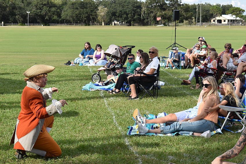 The Legend of Sleepy Hollow character Yost (Lev Siegel) interacts with the crowd during the opening moments of Saturday afternoon's performance.