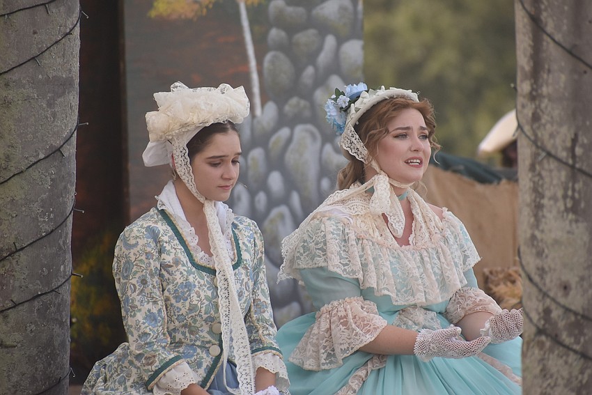 Greta (Raina Khatami) and Katrna Van Tassel (Brenna Griffith) discuss Ichabod Crane during Saturday's performance of The Legend of Sleepy Hollow.