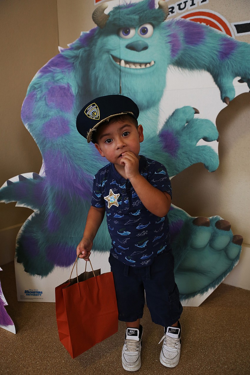 Ethan Aguilar stands with Sully.