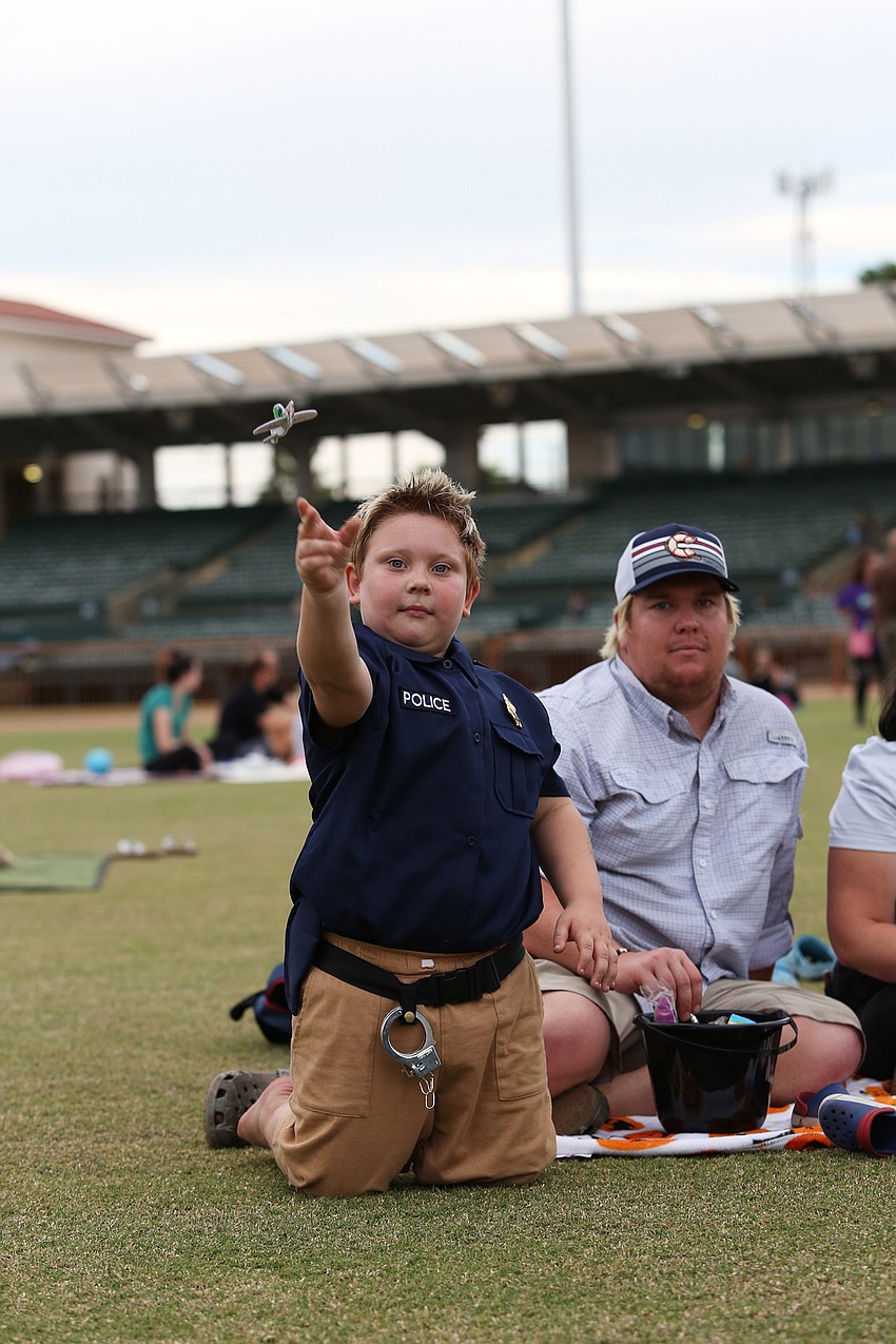 Hunter Hall throws a paper airplane.