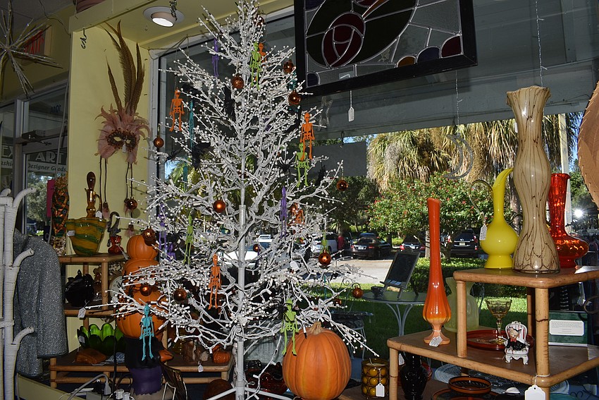 At Steff's Stuff, the front window sparkles with a Halloween tree.