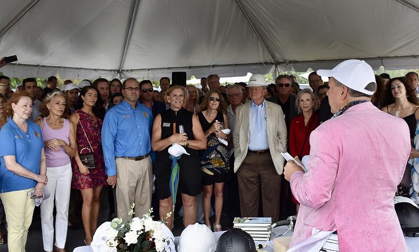 Unicorp National Developments CEO Chuck Whittall addresses the invited guests.