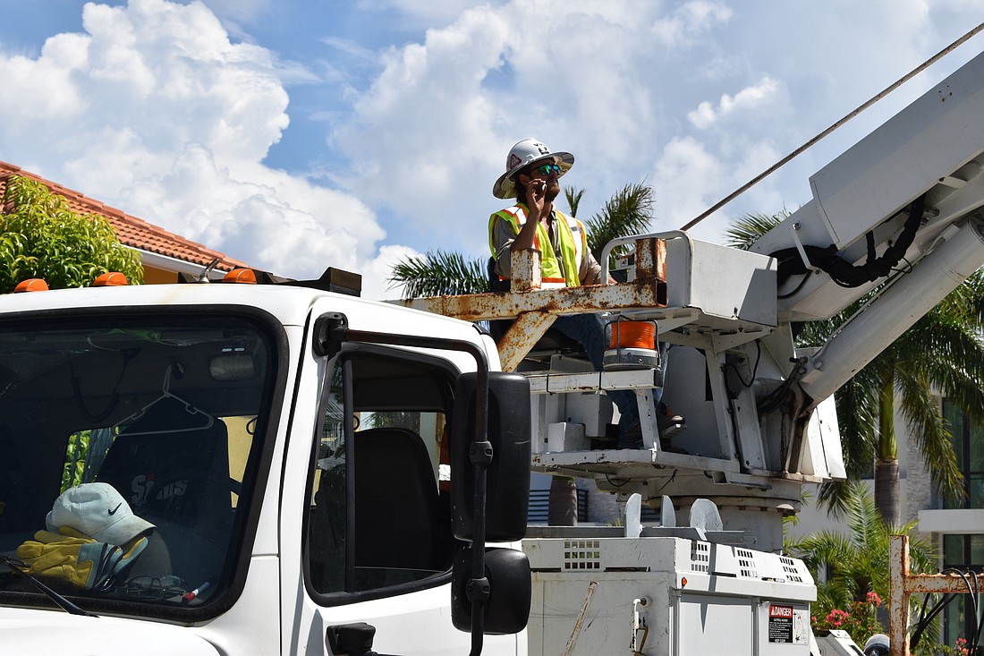 On July 22, Volt Power Co. lineman Heston Braddock worked to remove a light pole from Birdie Lane. File photo