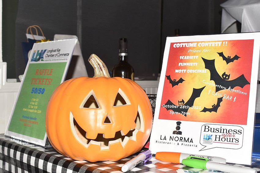 A grinning jack-o-lantern greeted attendees checking in.