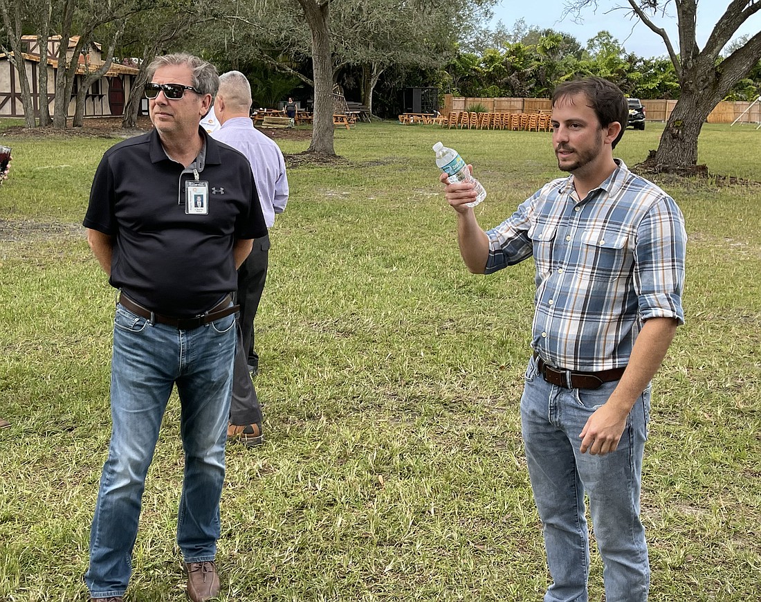 Sarasota Medieval Fair President Jeremy Croteau (right) discusses some features of the Medieval Fair site in Myakka City with Manatee County Deputy Administrator Charlie Bishop Friday.