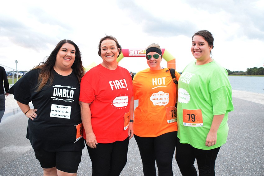 Sarasota's Kayla Polson, Tammy Polson, Ami Cox and Alisha Polson dress as Taco Bell sauce packets for the Boo Run.