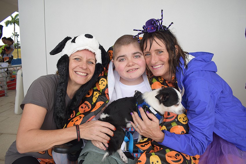 Lakewood Ranch's Monika Oberer, Grayson Tullio and Jennifer Tullio love participating in the annual Boo Run. Oberer and Grayson Tullio dressed as pandas this year.