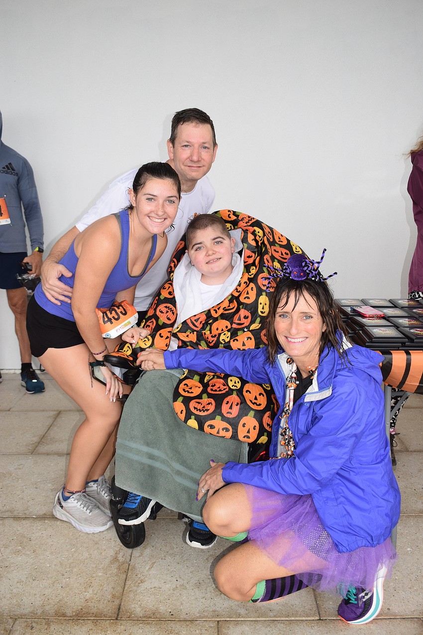 Lakewood Ranch's Nick Tullio has fun at the Boo Run with his children, Emma and Grayson Tullio, and his wife, Jennifer Tullio.