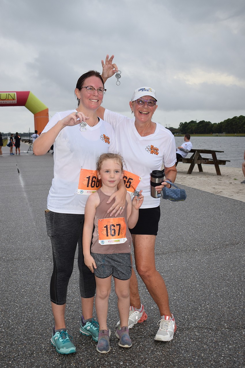 Lakewood Ranch's Erin Bonnici runs with her 5-year-old daughter Camryn Bonnici and her mother, Cheryl Hess. The Boo Run was Camryn Bonnici's second 5K.