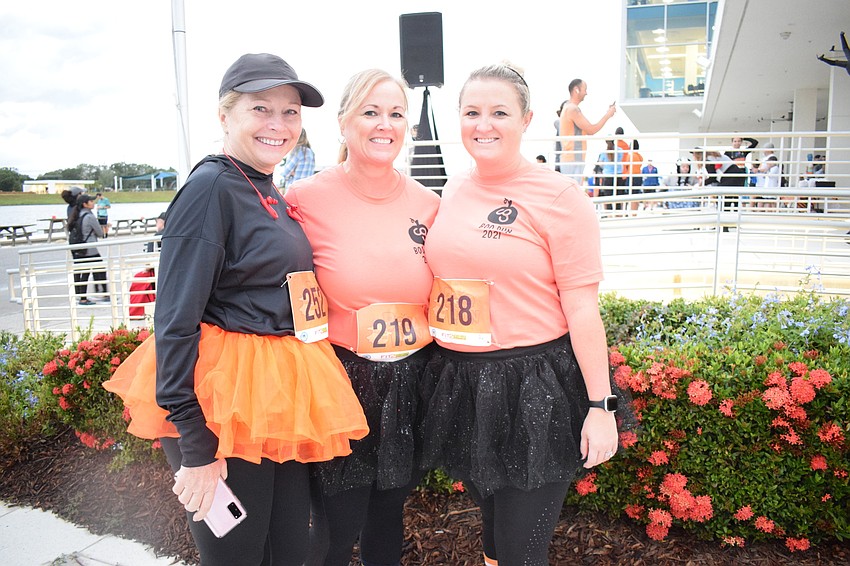 East County's Tina Mancini, Gwen Paulsen and Taylor Frank are excited to be with friends during the Boo Run.
