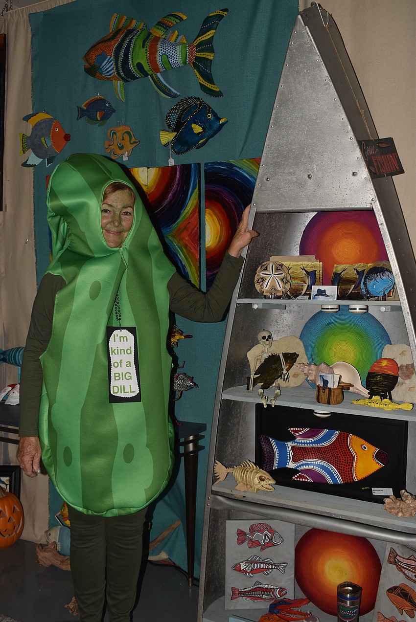 Kendal Kiner greeted trick-or-treaters as a pickle.