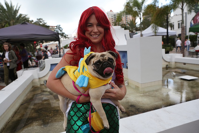 Morgan Clifford holds up Daisy.