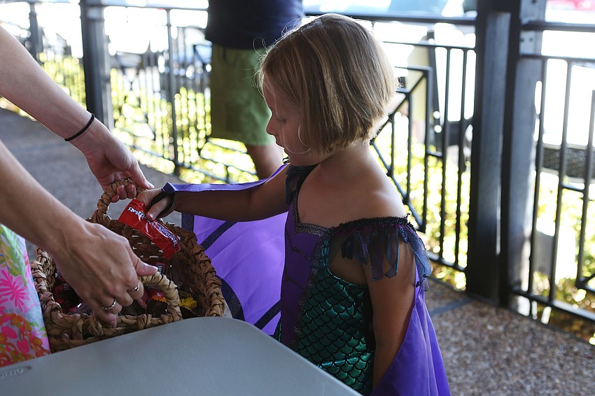 Kallie Barnes picks up treats.