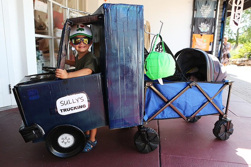 Sully Henry walks around with his truck.