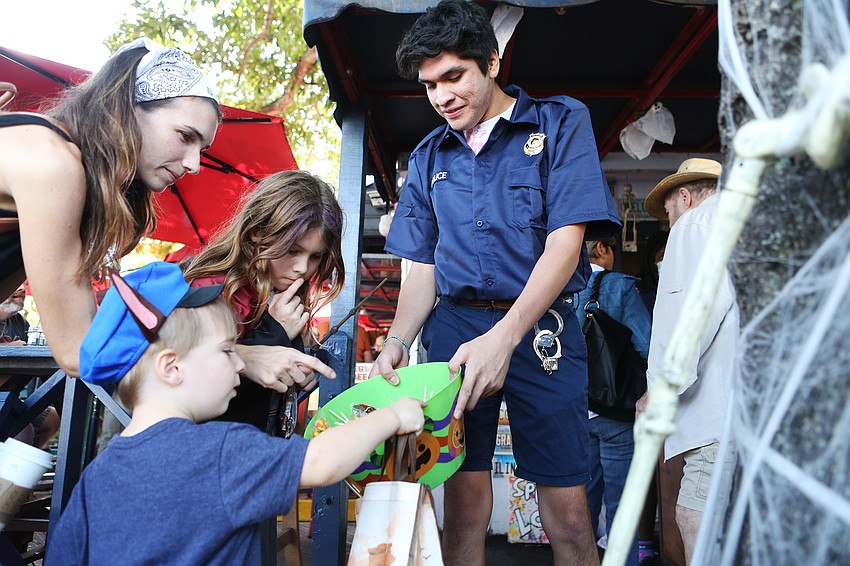 Warren Mersek dressed like a police officer and searched for candy.