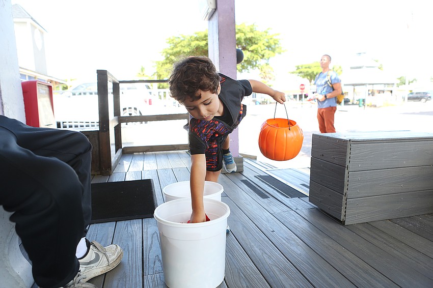 Harrison Parkes picks up treats.