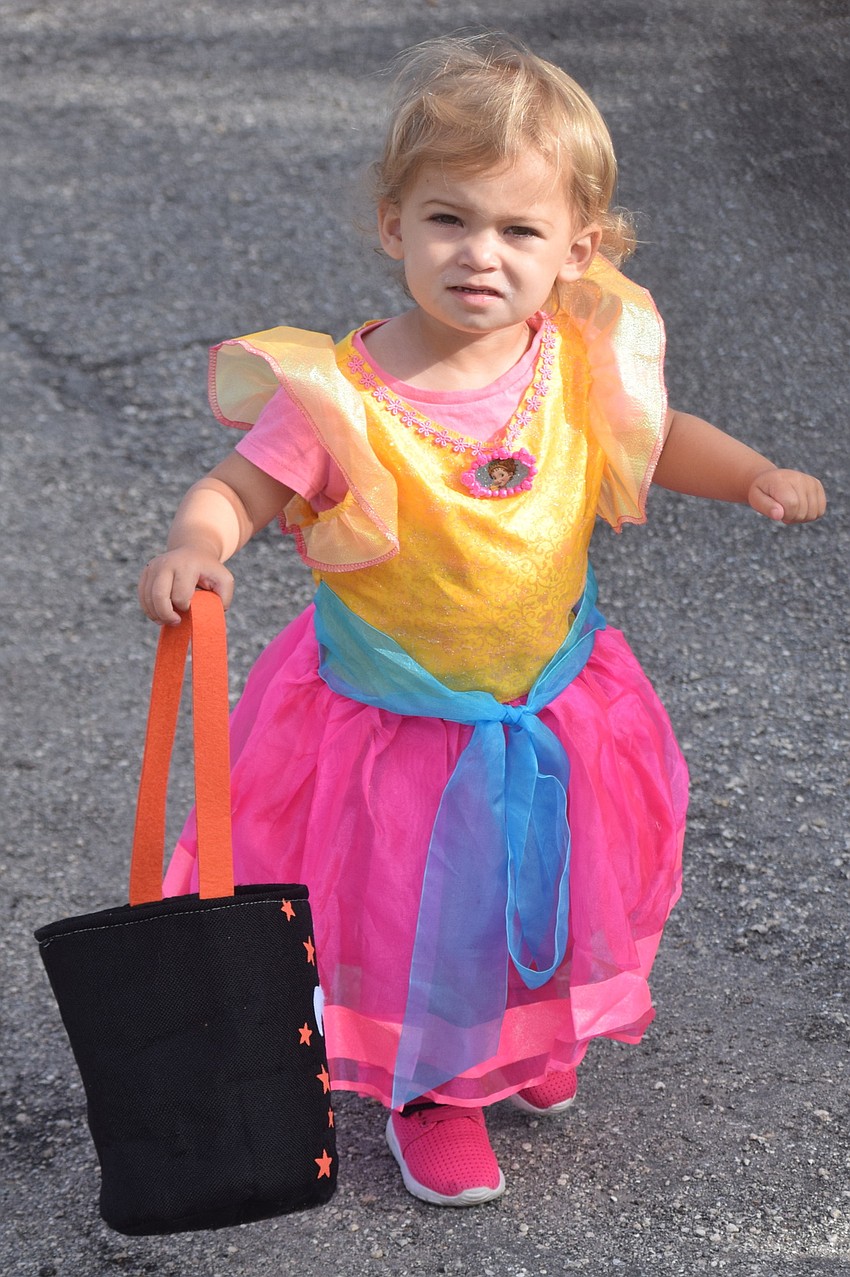 Lakewood Ranch 2-year-old  Amelia Dinapoli looks for the next stop at Boo Fest.