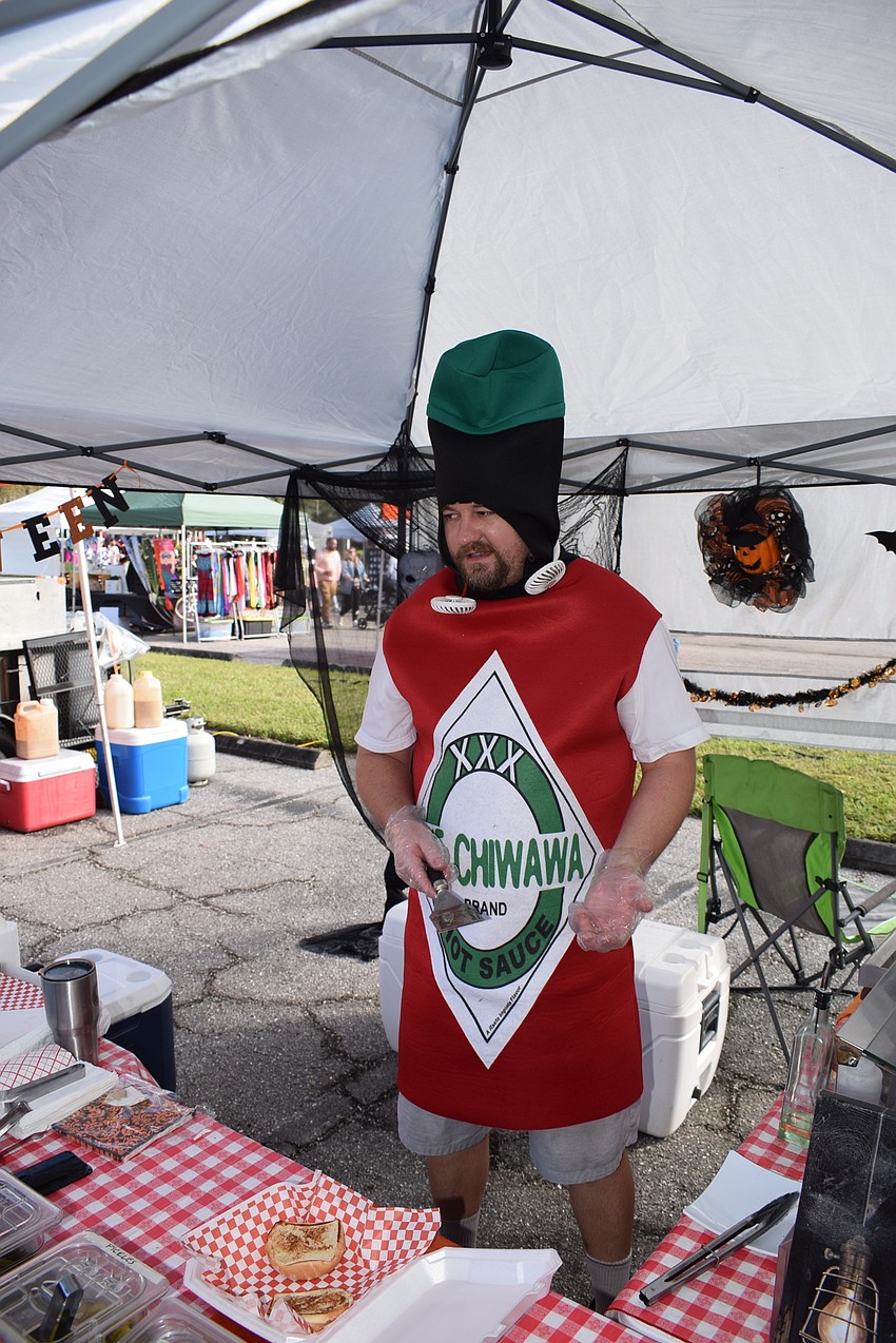Bradenton's Andor Budai decided to put some spice into his costume. Budai owns Andor's Cake World and he also was flipping burgers.