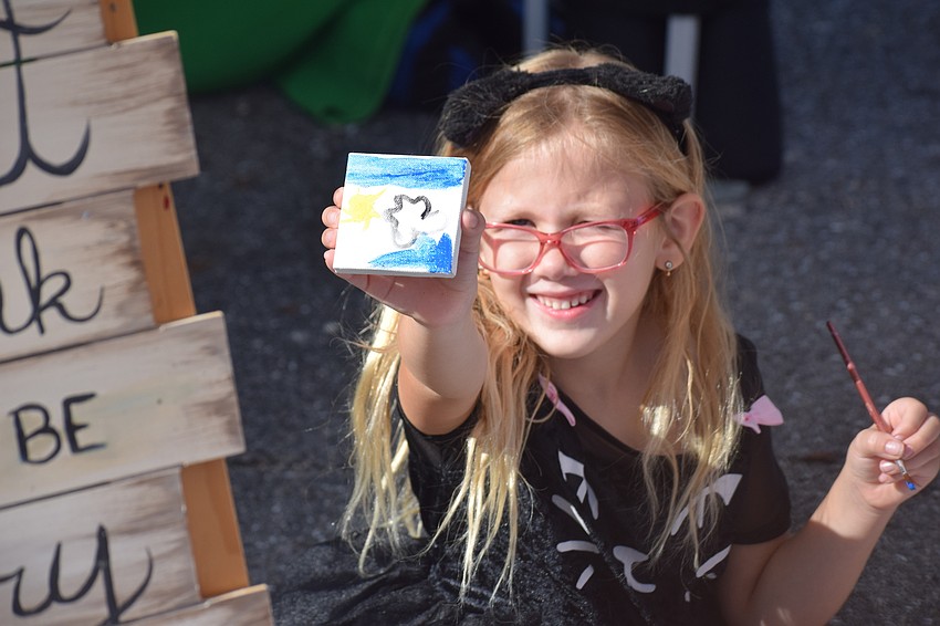 Lakewood Ranch 6-year-old Arya Pollack was enjoying the crafts booth, doing a little painting.