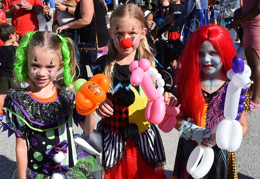 Lakewood Ranch  5-year-old Chloe Moody and 7-year-old Paiten Moody, along with Sarasota 5-year-old Jordyn Pryon show off their balloon animals.