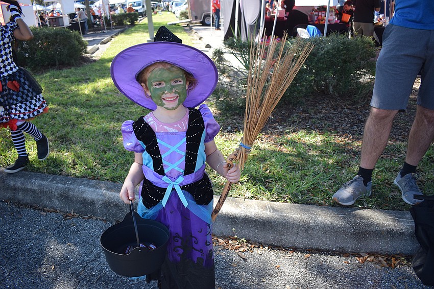 Parrish 5-year-old Ryan Hallam would attest there isn't much better than a bucket full of candy and a fun costume. She was enjoying BooFest at the Farmers Market at Lakewood Ranch.