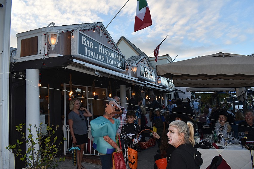 Diners shoot silly string into the path of trick-or-treaters.