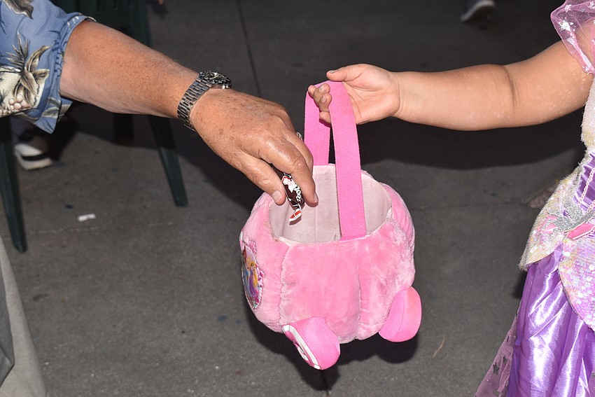 John McGee hands out candy.