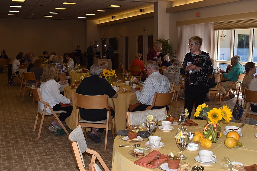 Before the meal, attendees made their way around the room to catch up with old friends.