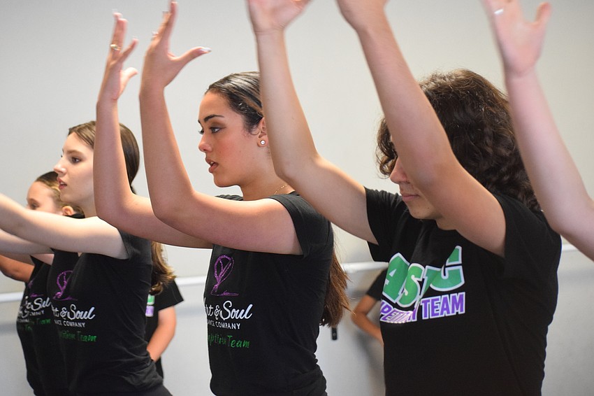 Claire Gonzales, Kayla Downes and Anthony Longo work during a rehearsal at Art and Soul Dance Company.