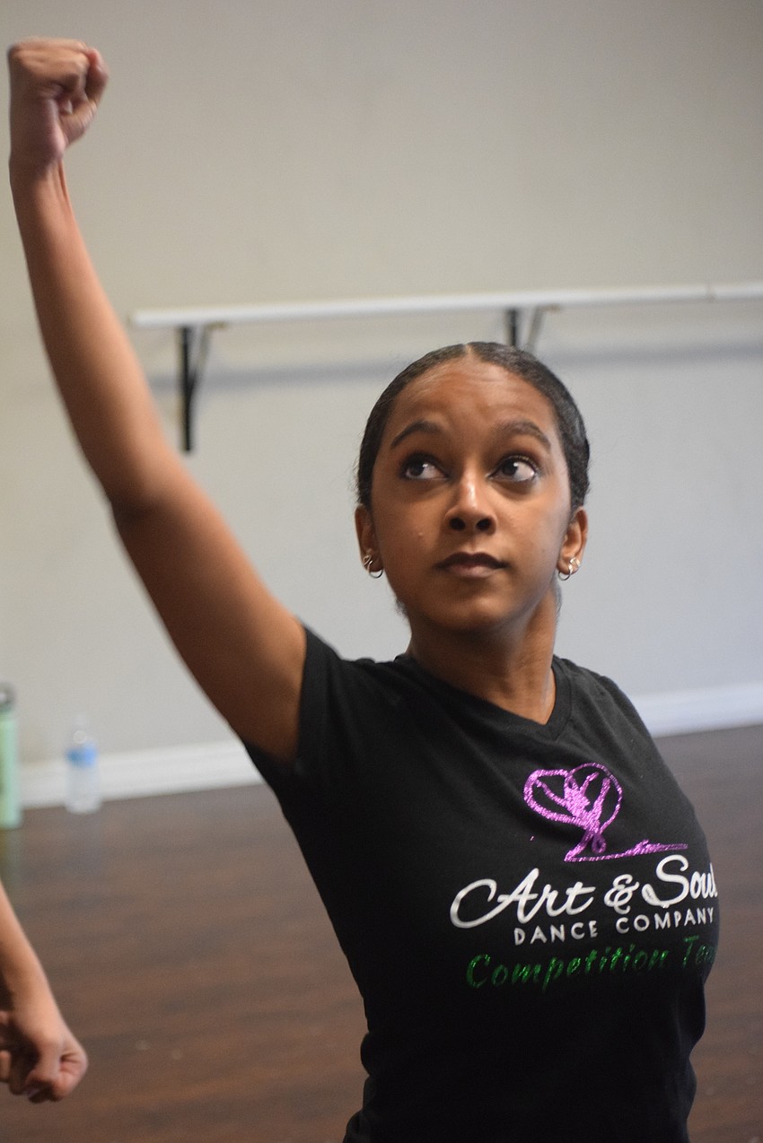 Mya Richard-Bennet concentrates on her movements during a workout.