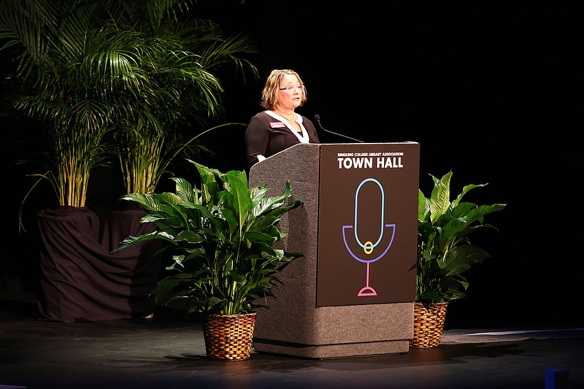 Tidewell Foundation president Debbie Mason welcomes Genova to the stage.